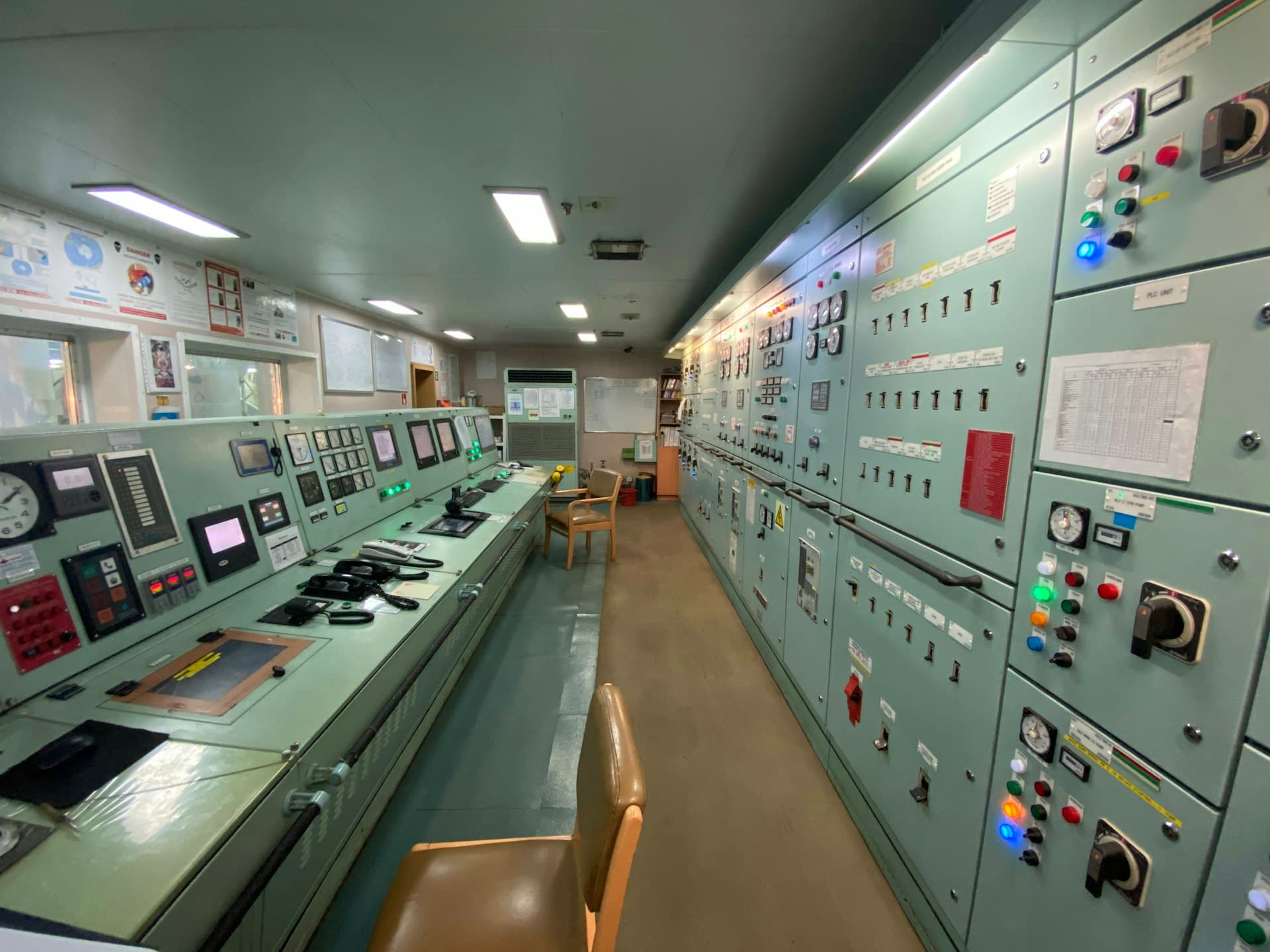 Industrial control room with operator stations